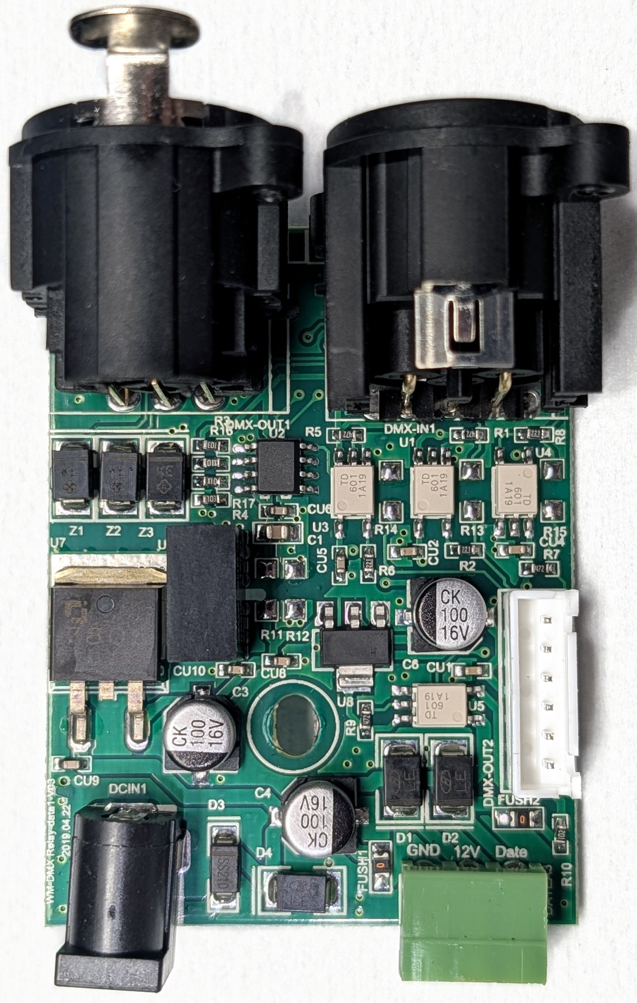 Chauvet DMX-RT I/O and power board showing the DC jack, 7805 and 1117C-3.3 regulators, Mornsun isolated DC/DC converter, four TD 601 optocouplers, 3PEAK TP75176E RS-485 transceiver, and two XLR connectors