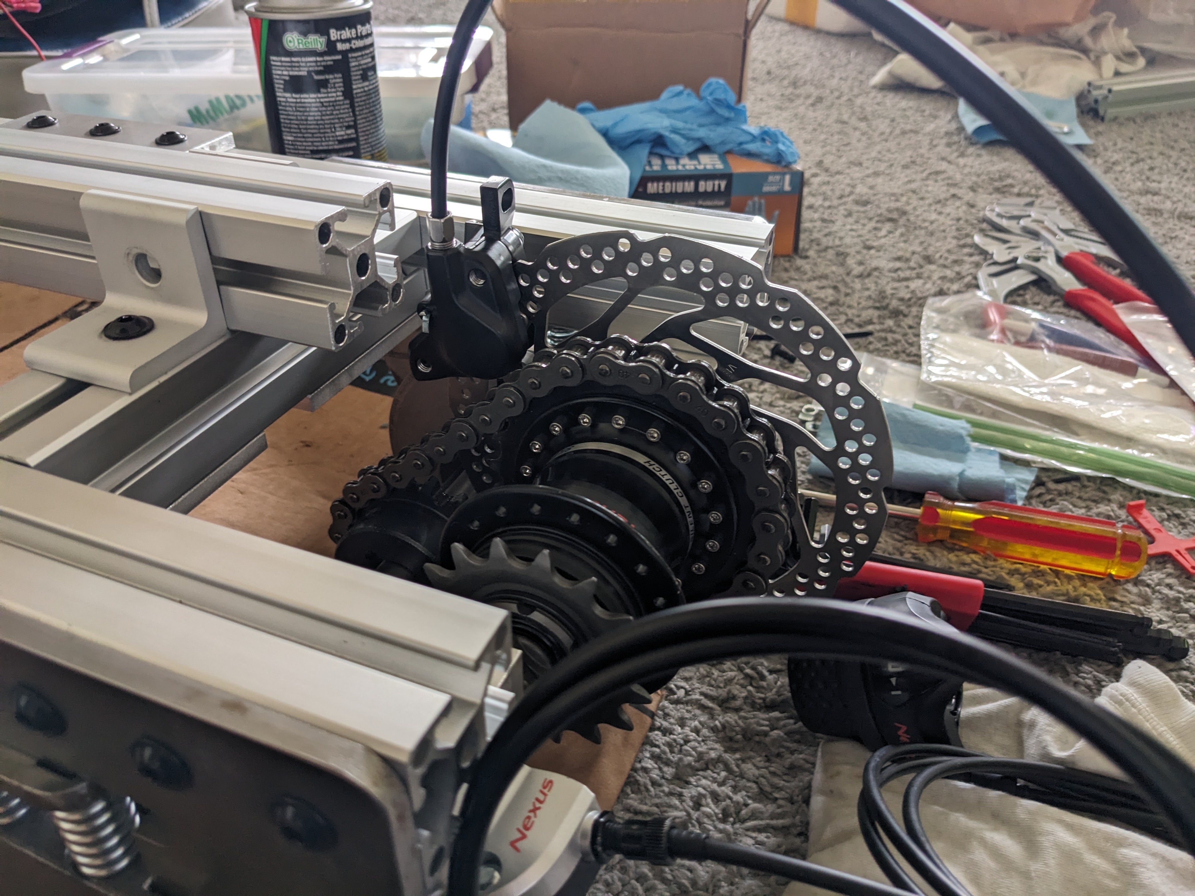 Geared hub installed on train's frame at a different angle showing the output sprocket's engagement with the hub