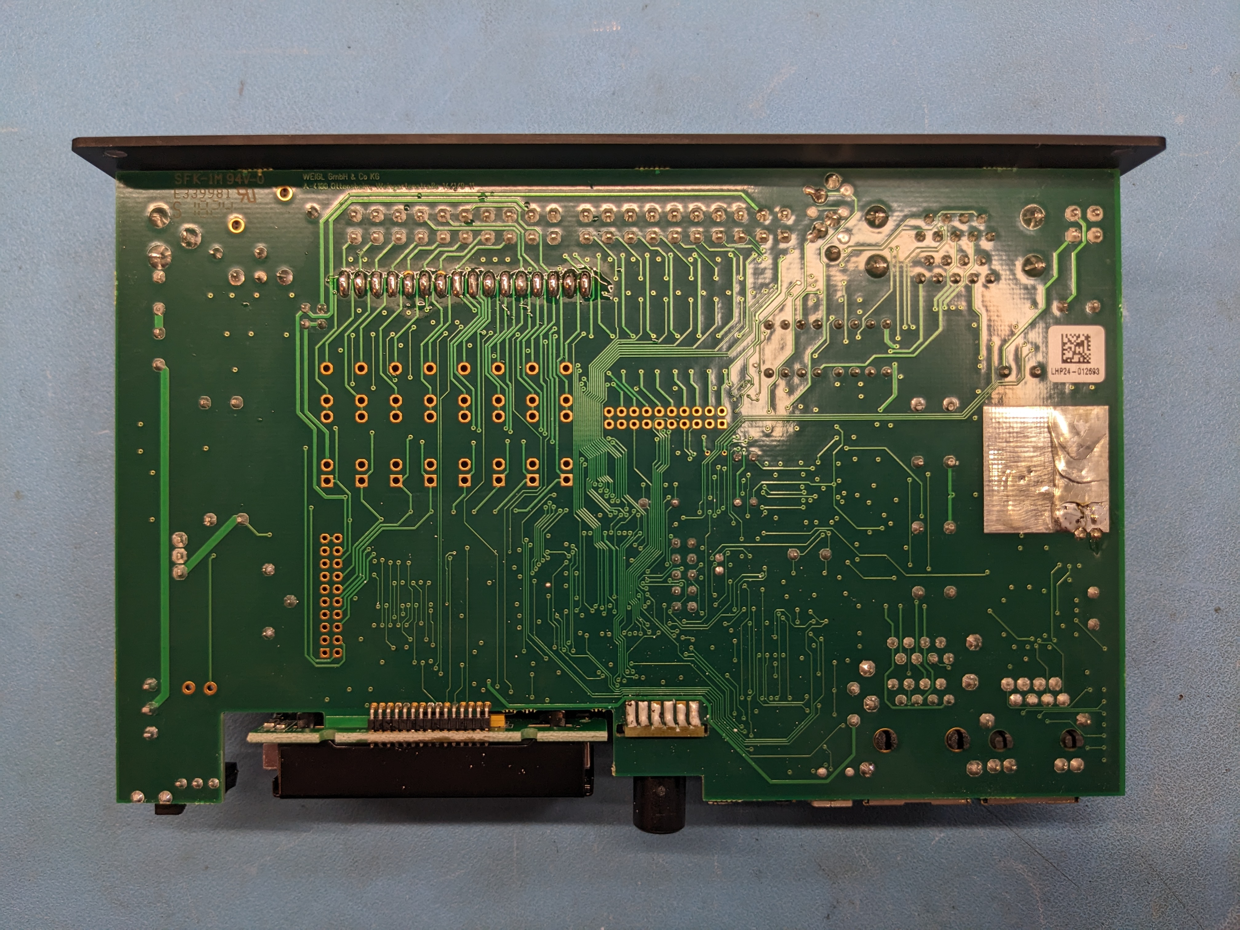 Weigl ProCommander4 main PCB bottom view showing exposed copper thermal pad for TPA3123D2 class D amplifier heat dissipation