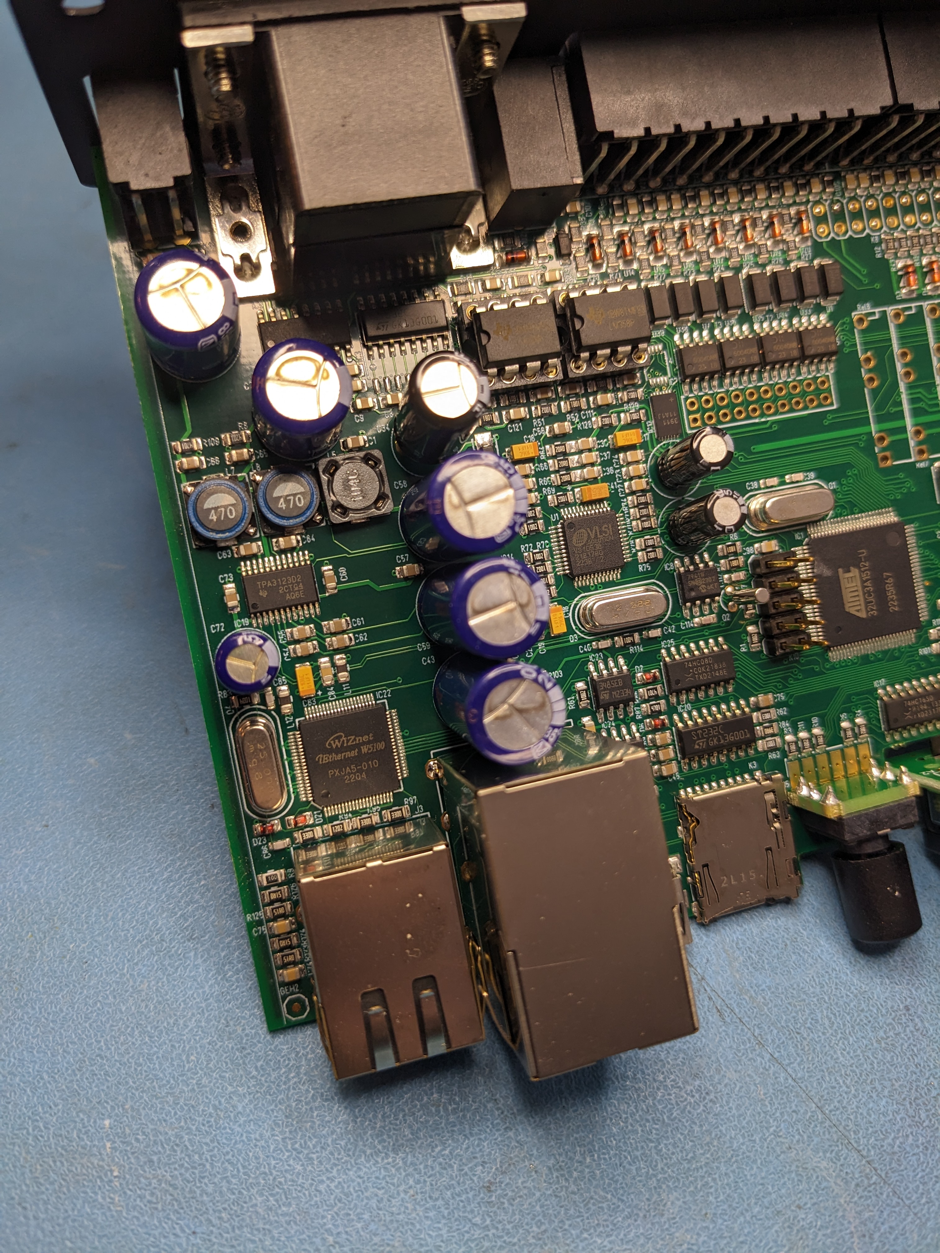 Weigl ProCommander4 PCB network and audio playback region showing WIZnet W5100 Ethernet controller, VLSI VS1053b MP3 codec, STMicroelectronics ST232C RS-232 transceiver, DS3911 DAC, and 3.5mm line out jack